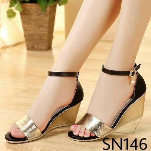 a pair of shoes with a black strap