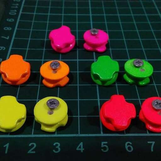 a close up of a board with colored buttons