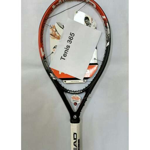 a tennis racket with a lot of stickers on it.