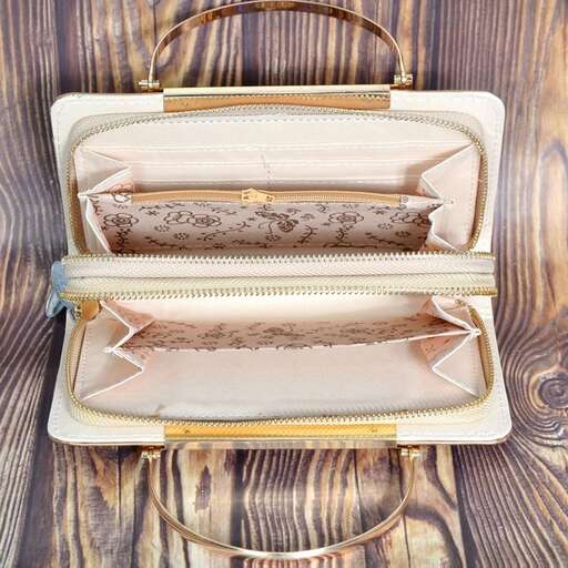 a bag that is sitting on a wooden table.