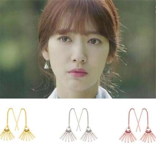 a woman with earrings in a shape of a heart