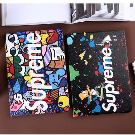 a couple of notebooks sitting on top of a table.