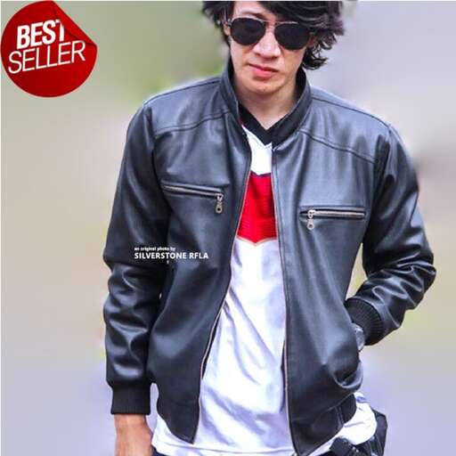 a young man in a leather jacket