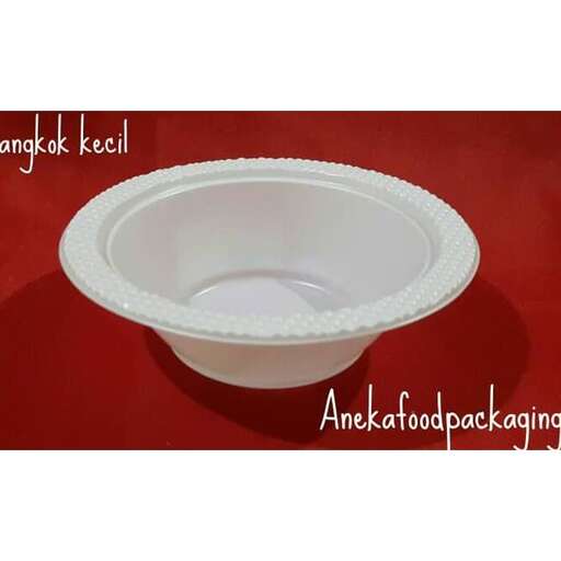 a bowl with a spoon inside of it.