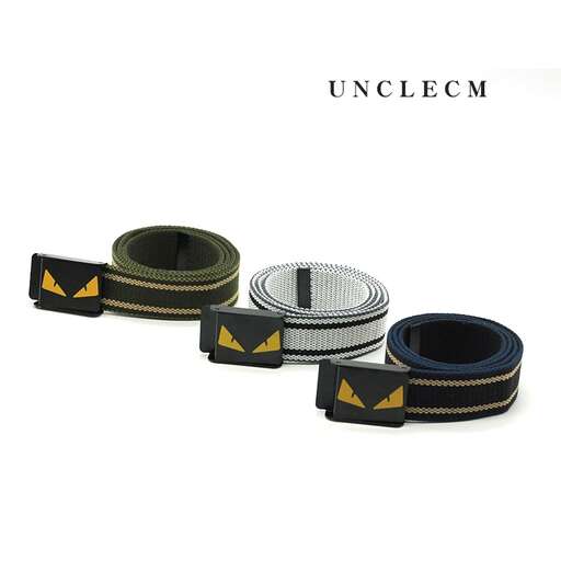 a belt made of black leather with a little bit of orange.