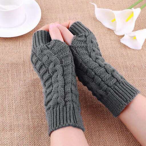 a pair of mittens with a white flower in the middle.