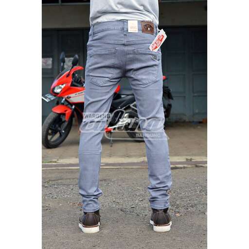 a pair of jeans with a white belt
