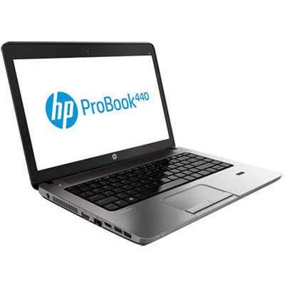 a laptop computer with a blue logo on the screen.