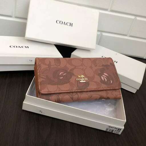 a wallet sitting on top of a wooden table.