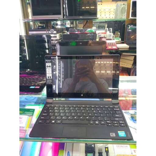 a laptop computer sitting on top of a desk.