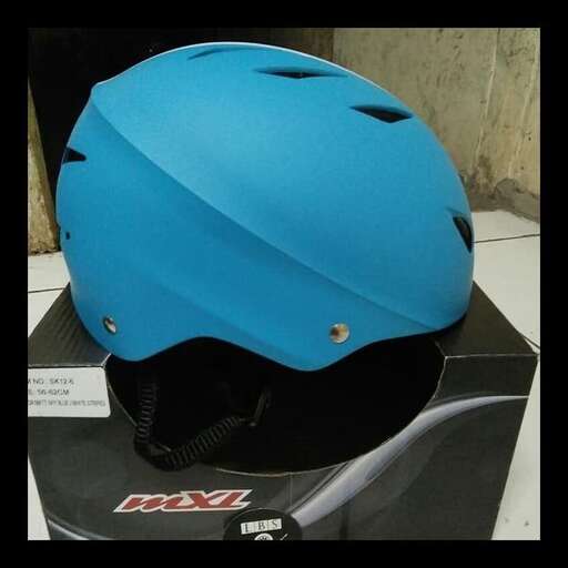 a blue helmet is sitting on a box.