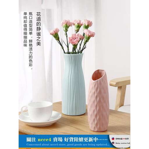 pink roses in a blue vase