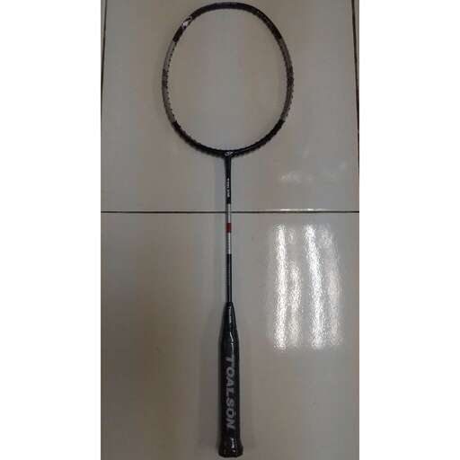 a black and white picture of a mirror hanging on a wall.