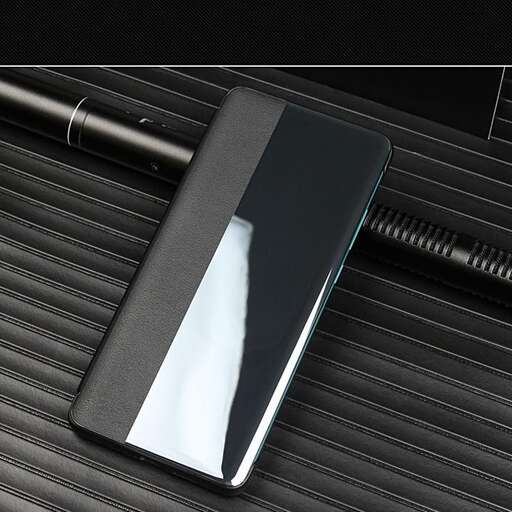 a black and silver cell phone with a black base.