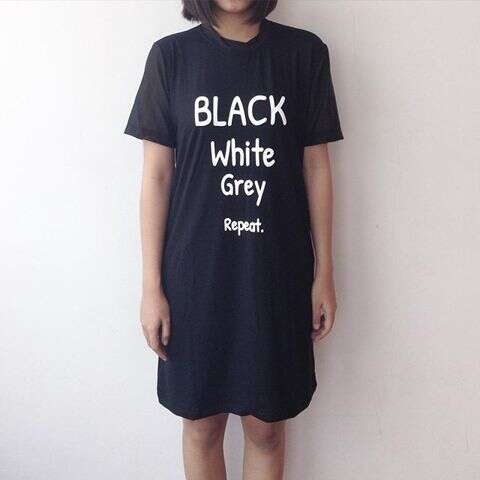 black dress with white letters on front and black shirt.