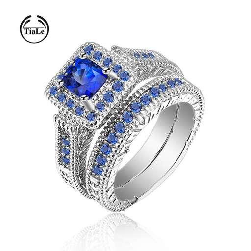 a ring with a blue sapphire and diamonds.