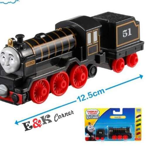 a toy train with a face on the front and a toy train on the front.