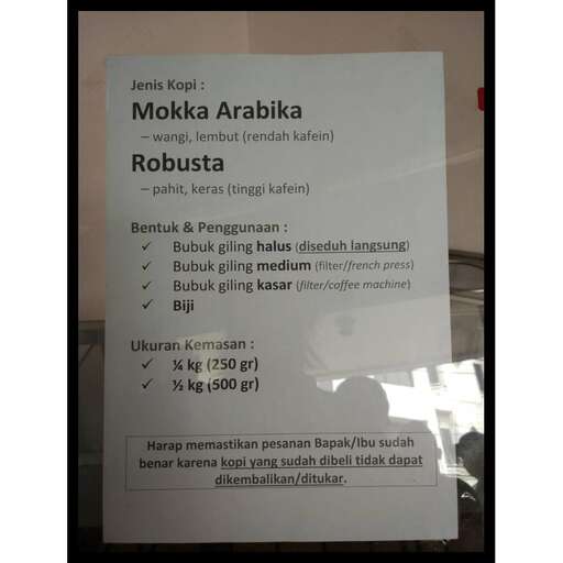 a poster in the window of the train station.