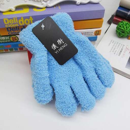 a pair of blue gloves sitting on top of a table.