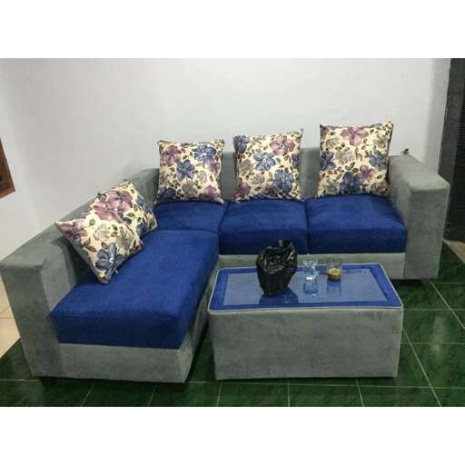 a blue couch with a blue ottoman and a blue ottoman.