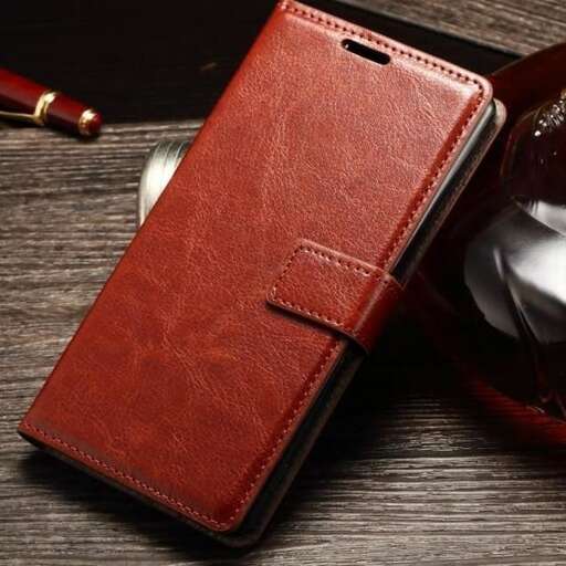 a red leather wallet with a pen and a pen in it.
