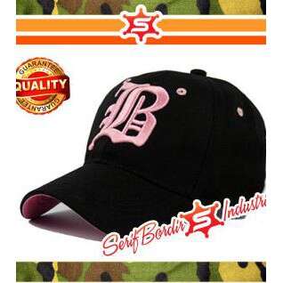 black hat with white lettering and a pink b. c.