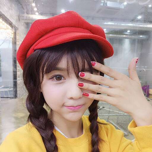 a girl in a red hat