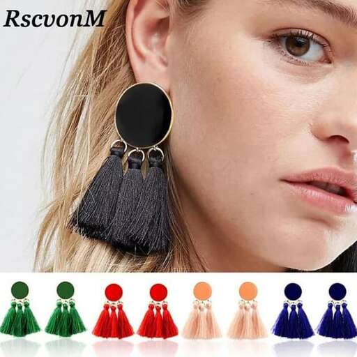 a pair of earrings with a black fringe.