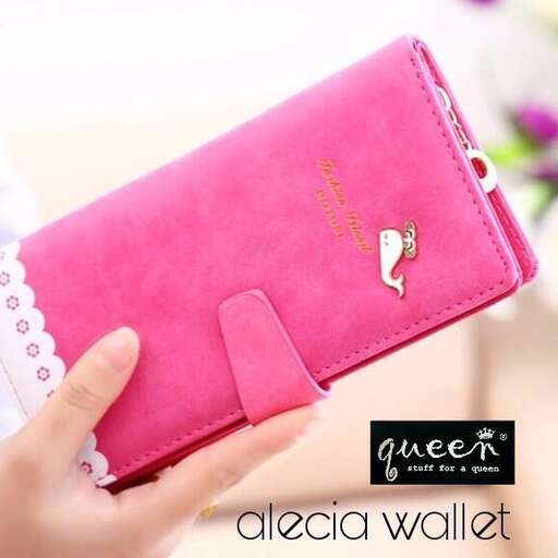 a pink wallet with a note on it.