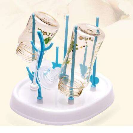 a glass candle holder with a blue candle in it.