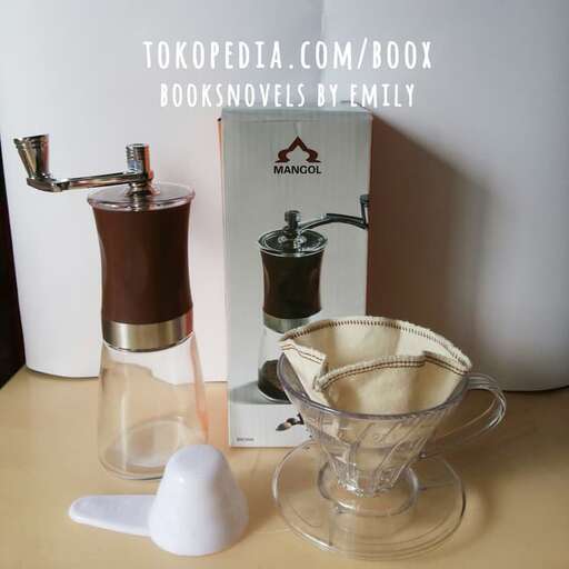 a kitchen counter with a mixer and a bowl of food.