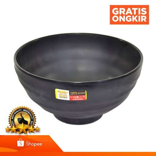 a bowl made of black plastic with a gold finish.
