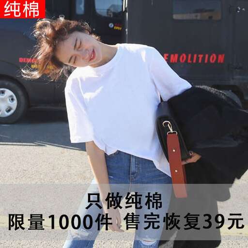 a woman carrying a bag of luggage on her shoulder.