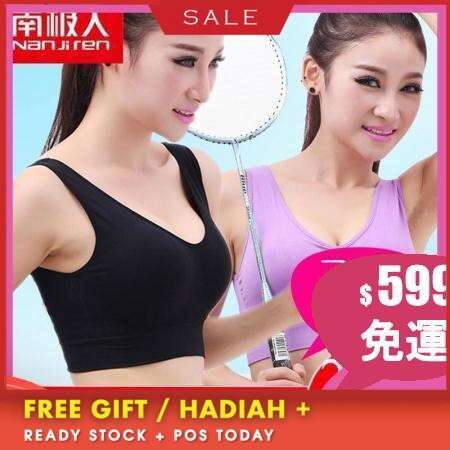 a woman in a black top and pink tank top.