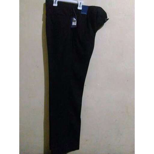 black pants hanging on a wall