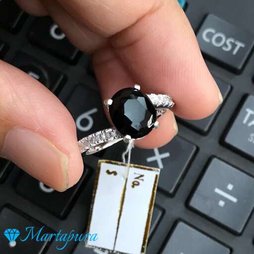 a diamond ring with a stone inside.