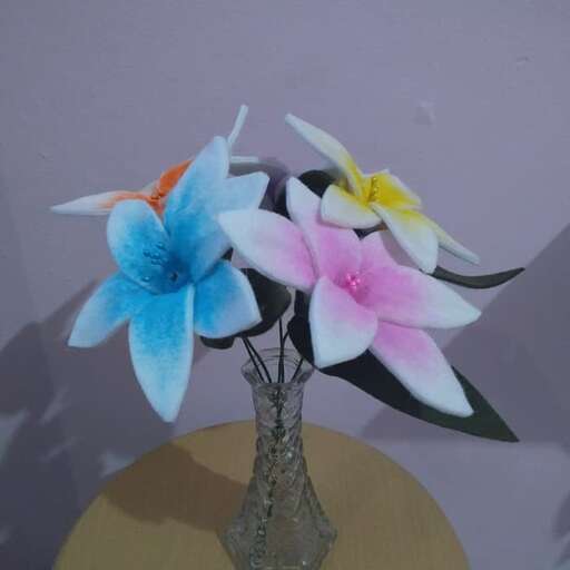 a vase with flowers on a table.