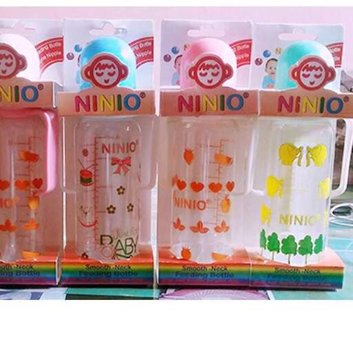 a set of three plastic water bottles with a little bit of orange in the middle.