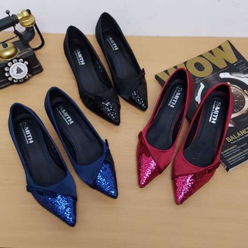 a selection of shoes and accessories from the collection.