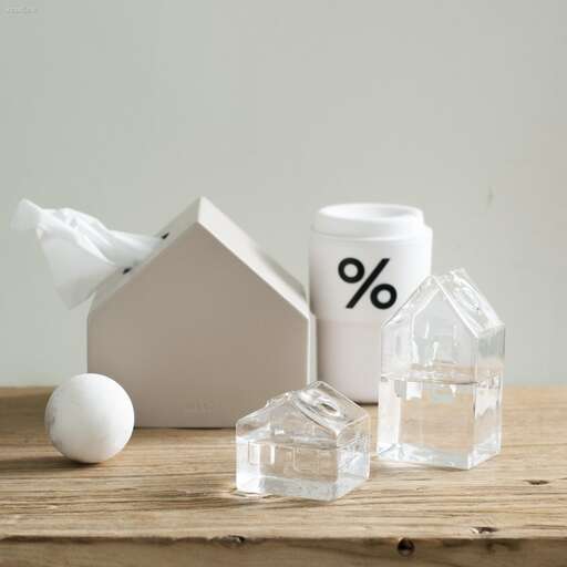 a house with a house and a small house on a table