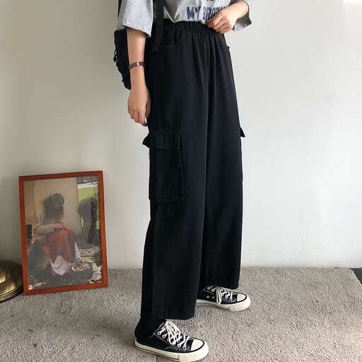 a boy in black pants and a t - shirt