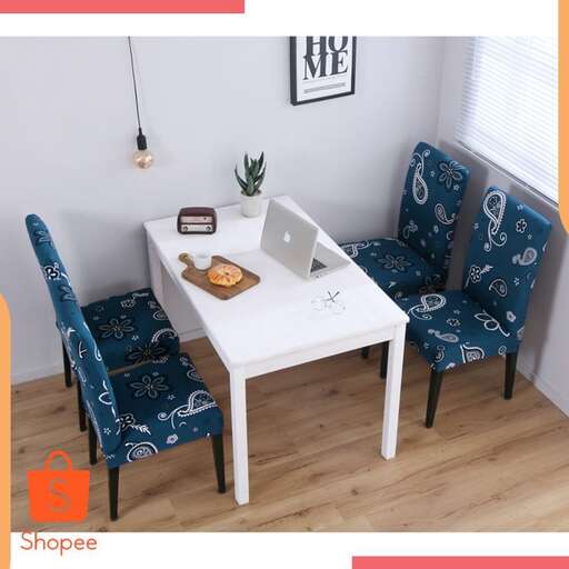 a small white table with a laptop on it.