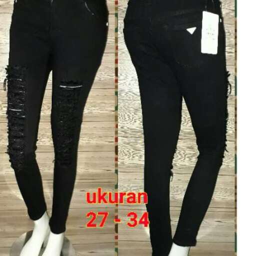 a pair of black jeans with a white tag