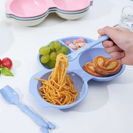 a person is putting food into a bowl.