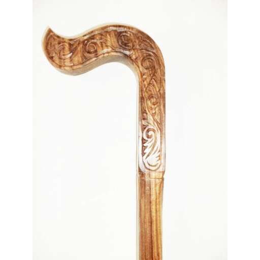 a carved wooden sword in the form of a large wooden letter.