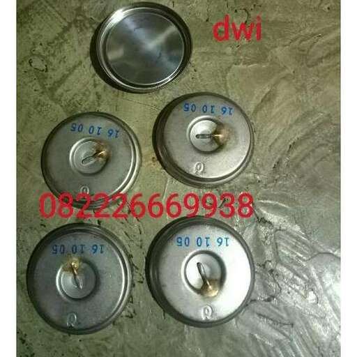 three metal knobs with three holes in them.