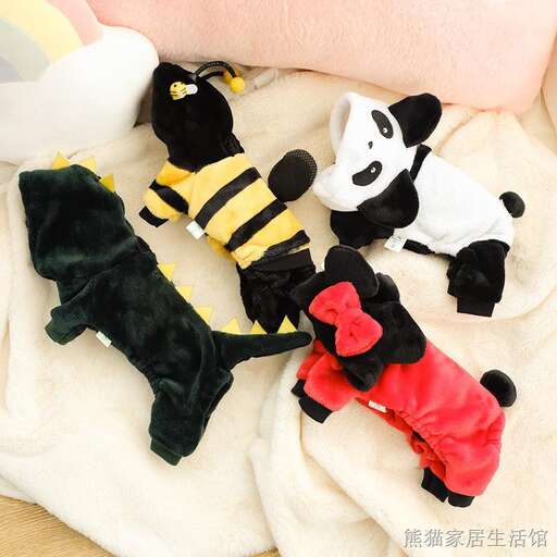 a group of stuffed animals sitting on top of a blanket.