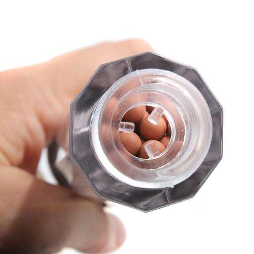 a bottle of pills that are being held in a hand.