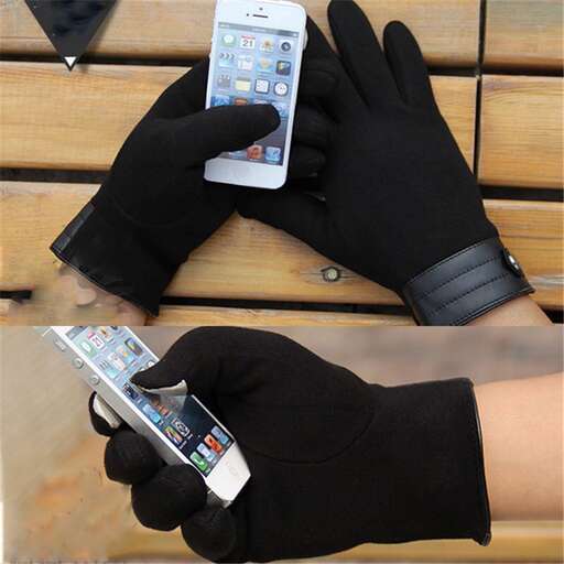a person wearing a glove and holding a cell phone.