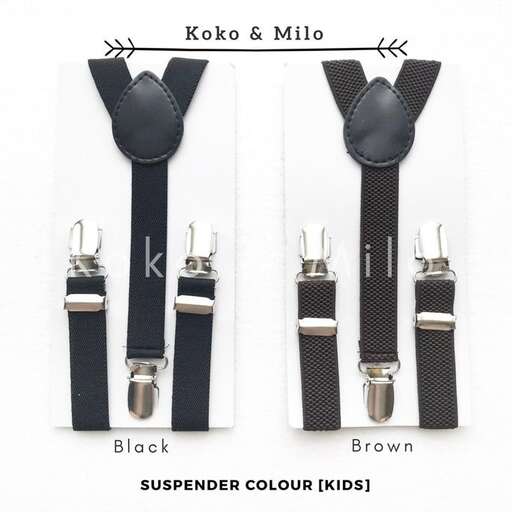 a black and white belt with a black strap and a black belt.